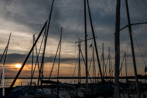 Fototapeta Naklejka Na Ścianę i Meble -  Little save haven with sailboats and a golden sunset
