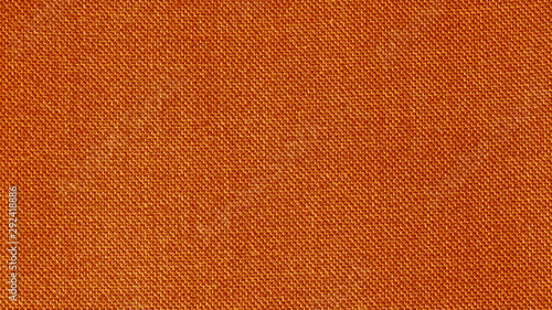 Orange woven fabric texture. Textile background. Closeup