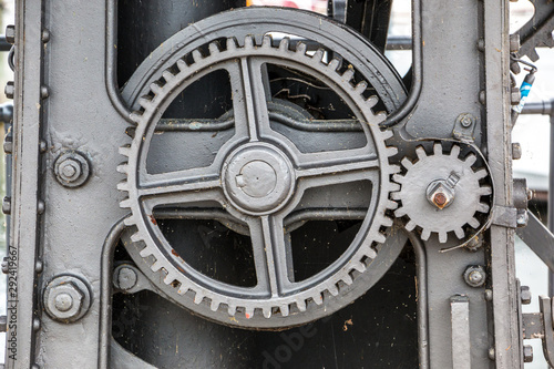 Old machine with toothed gears made of steel