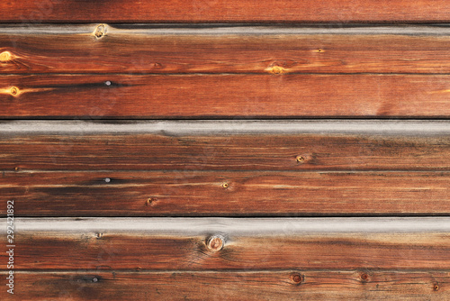 Stained natural wood plank texture background. Closeup