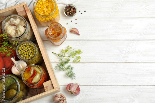 Wallpaper Mural Jars with pickled vegetables on white wooden table, flat lay. Space for text Torontodigital.ca