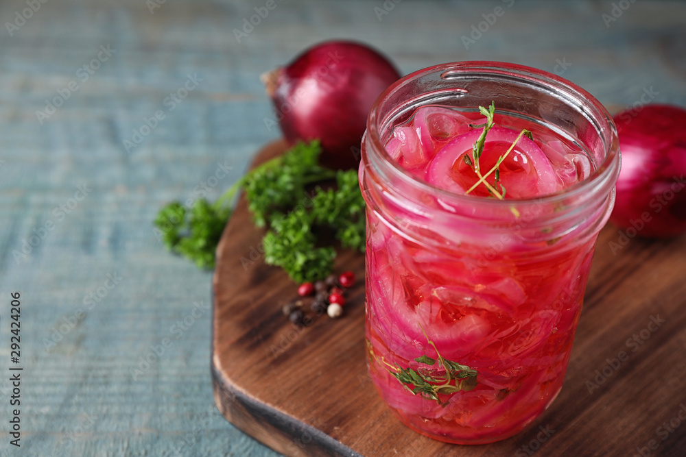 Jar with tasty pickled onions on wooden table Jar with tasty pickled onions on wooden table