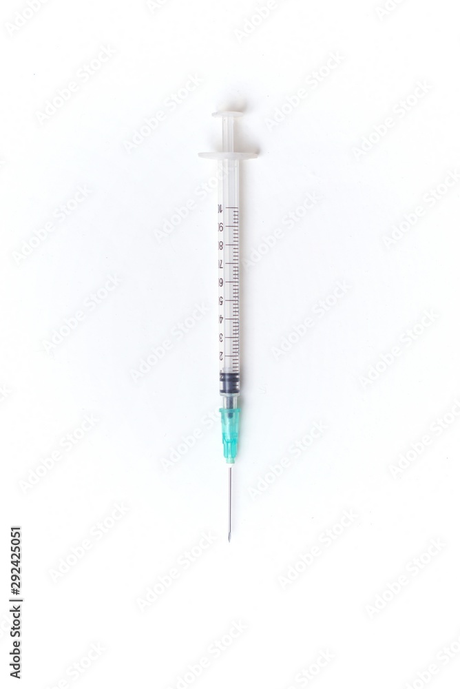 Plastic disposable syringe on white background. Plastic disposable syringe on white background.