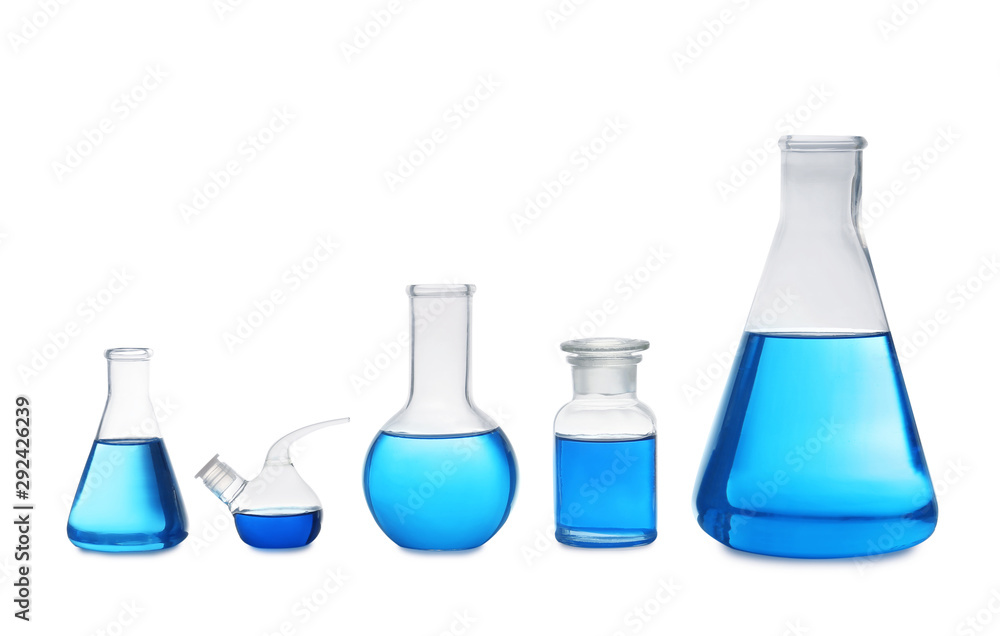 Set of laboratory glassware with blue liquid on white background Set of laboratory glassware with blue liquid on white background
