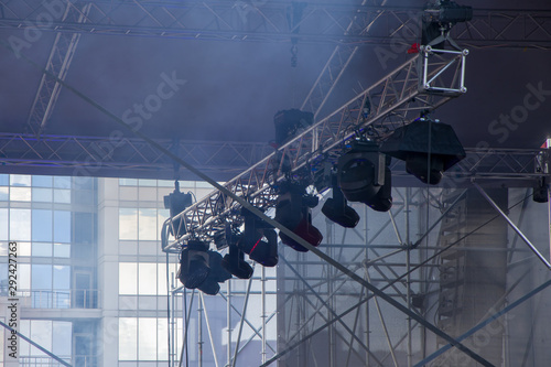 A light ramp suspended above the stage with floodlights and lighting fixtures  concert venues and equipment