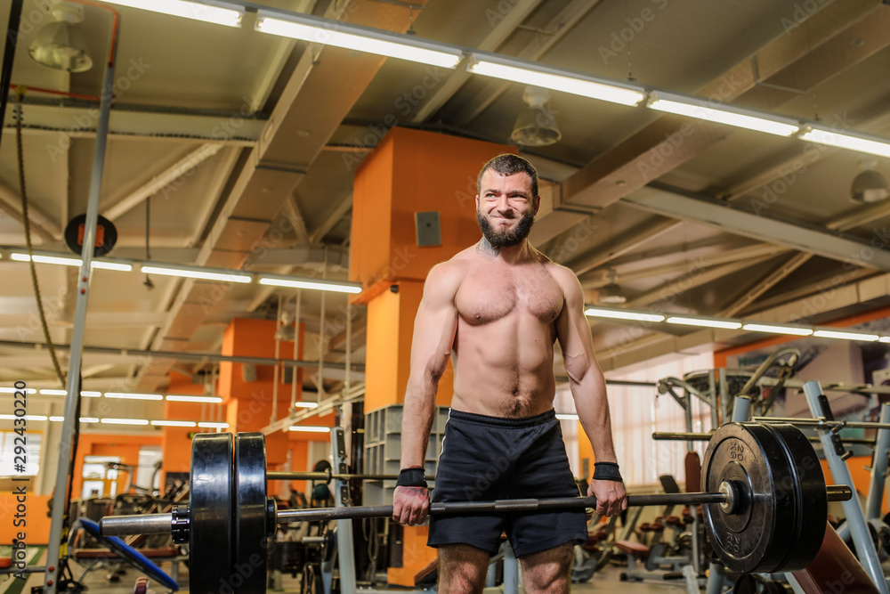 close up photo of a man lifting weights at the gym close up photo of a man lifting weights at the gym