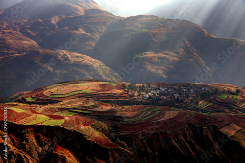 Dongchuan Red Earth Multi-Colored Terraces - Red Soil, Green Grass, Layered Terraces in Yunnan Province, China. Chinese Countryside, Agriculture, Exotic Unique Landscape. Farmland, Agriculture