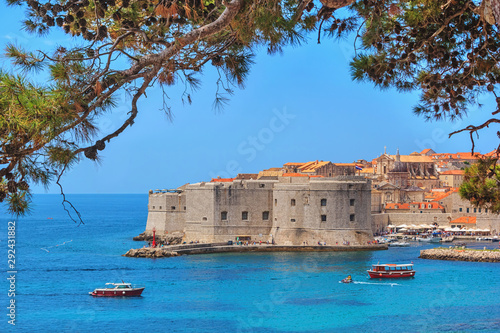 Coastal summer landscape - view of the St. John Fortress and the City Harbour of the Old Town of Dubrovnik on the Adriatic coast of Croatia photo