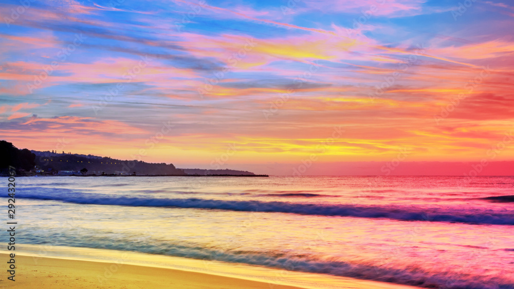 Fototapeta premium Seaside landscape - the beach with views of the sunrise over the sea, near the city of Varna, on the Black Sea coast of Bulgaria