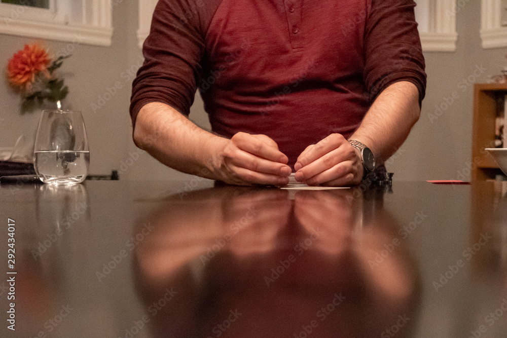 poker player with a deck of cards