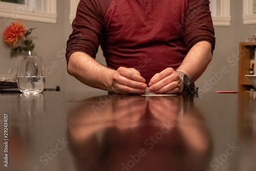 poker player with a deck of cards