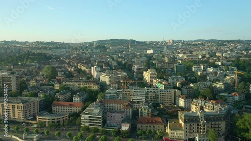 sunset time flight over lausanne cityscape bay aerial panorama 4k switzerland