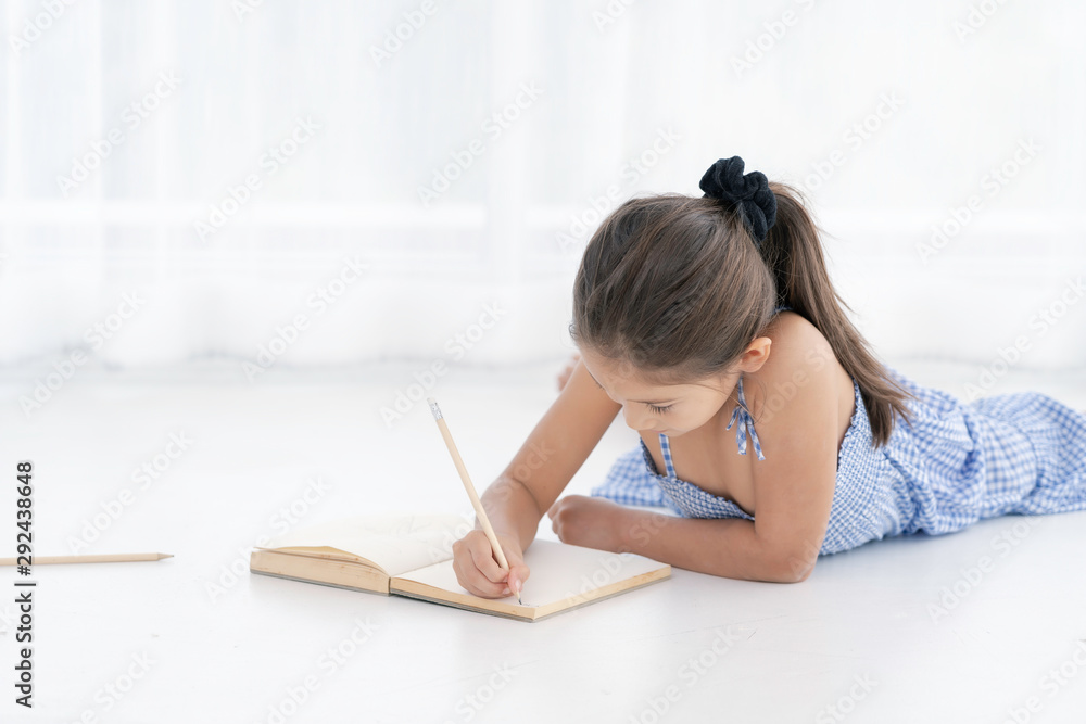 little cute girl write a paper little cute girl write a paper