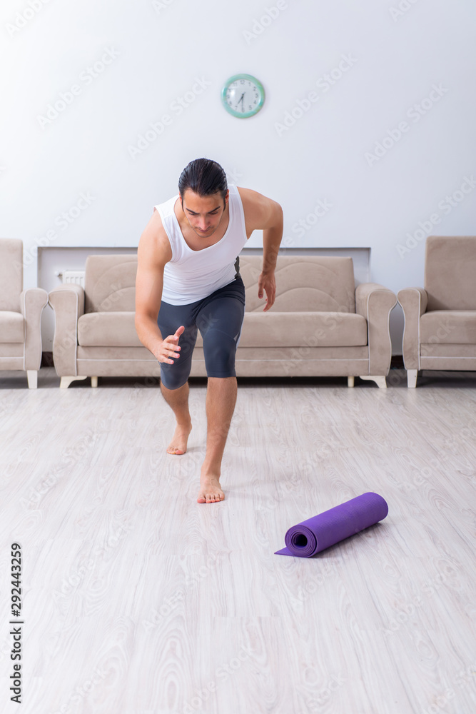 Young man training and exercising at home Young man training and exercising at home