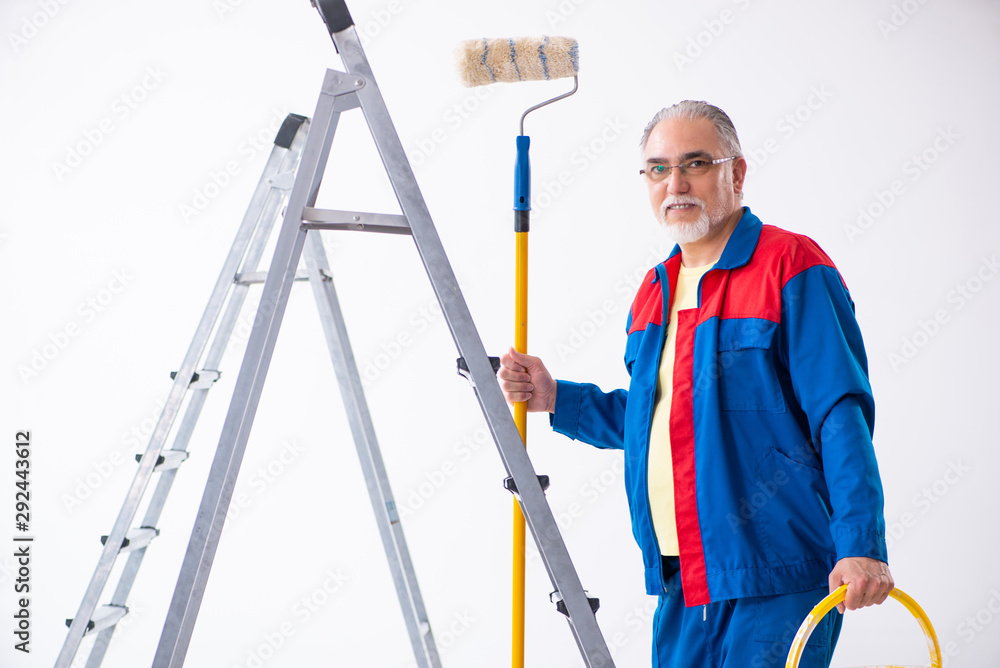 Old contractor doing renovation at home Old contractor doing renovation at home