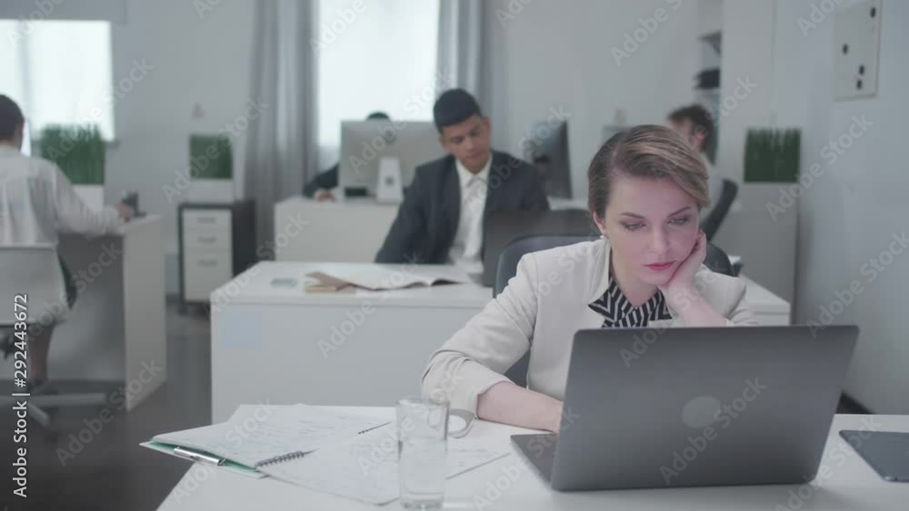 Woman at the office with a laptop. Woman at the office with a laptop.