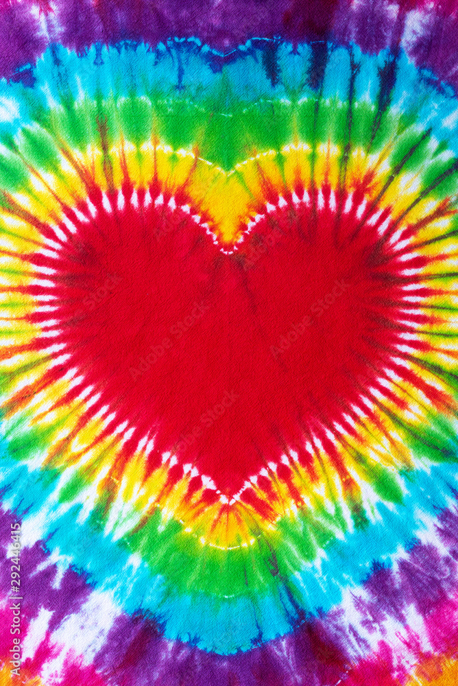 heart sign tie dye pattern hand dyed on cotton fabric abstract background. heart sign tie dye pattern hand dyed on cotton fabric abstract background.