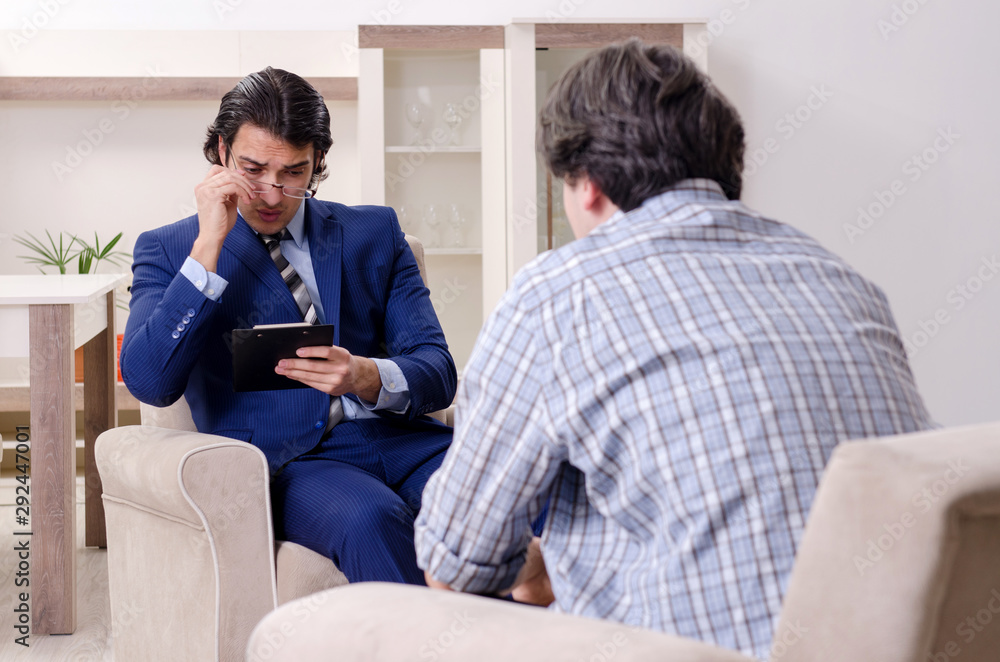Young male patient discussing with psychologist personal problem Young male patient discussing with psychologist personal problem