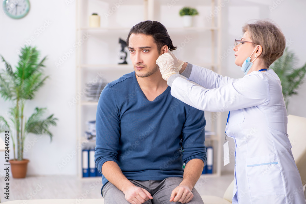 Young patient visiting doctor in hospital Young patient visiting doctor in hospital