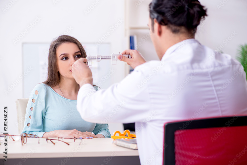 Young woman visiting male doctor oculist Young woman visiting male doctor oculist