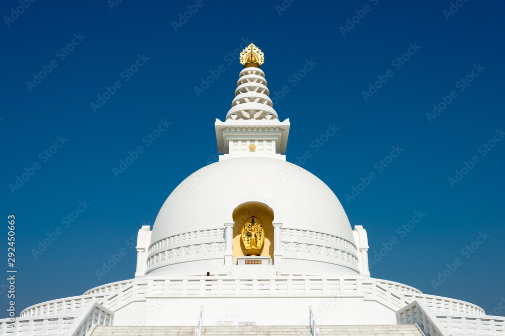 Lumbini, Nepal - Dec 10 2017: World Peace Pagoda in Lumbini, Nepal. Lumbini, the Birthplace of the Lord Buddha and The Eight Great Places. Lumbini, Nepal - Dec 10 2017: World Peace Pagoda in Lumbini, Nepal. Lumbini, the Birthplace of the Lord Buddha and The Eight Great Places.