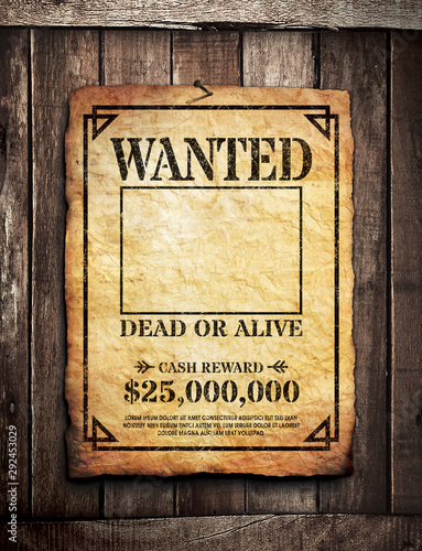 Wanted poster on wooden surface