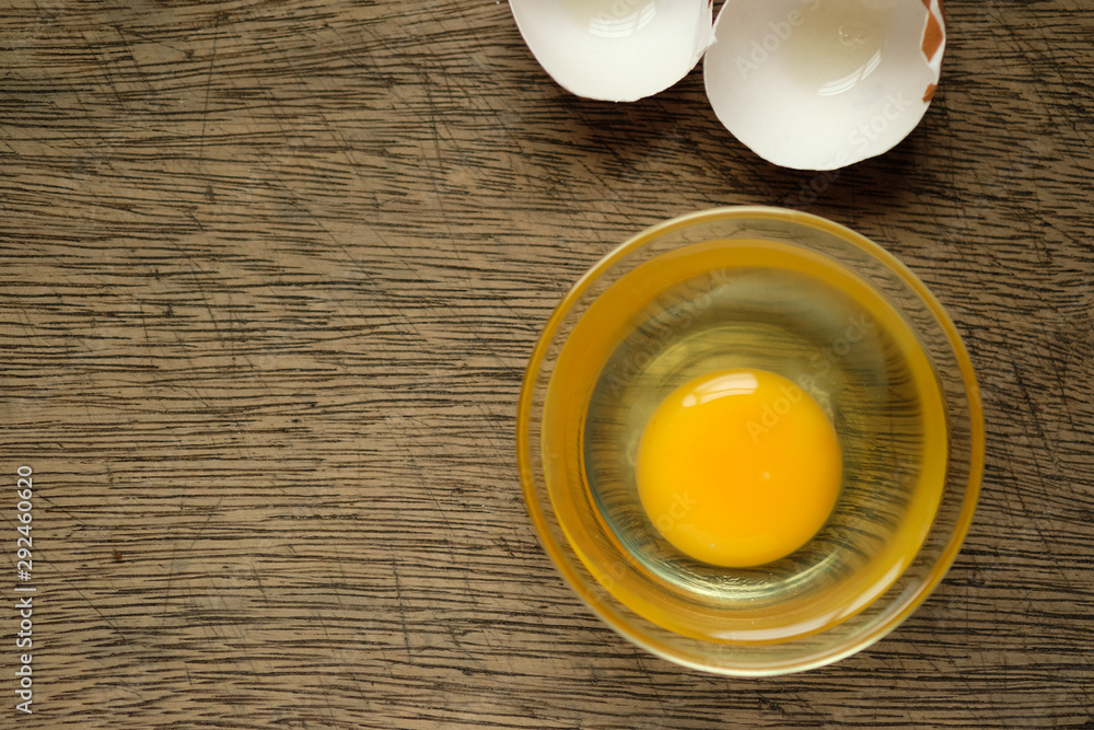 Eggs in a cup Lay on the wooden background and copy space Eggs in a cup Lay on the wooden background and copy space