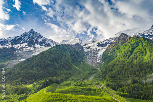 Spectacular landscape of alpine mountains and green meadow at Chamonix