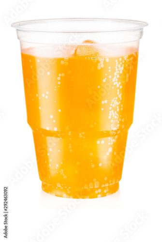 Orange carbonated drink with ice in a plastic cup isolated on white background