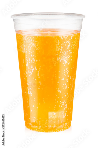Orange carbonated drink with ice in a plastic cup isolated on white background