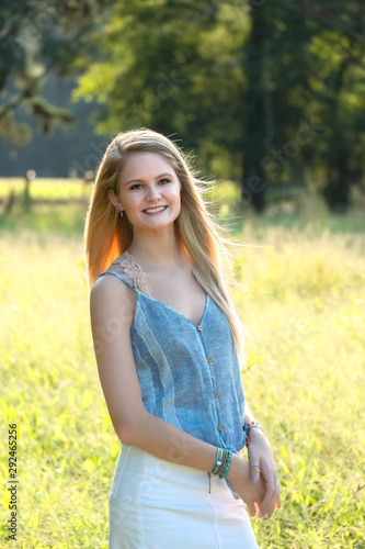 Young Blonde Teenage Girl in a Field