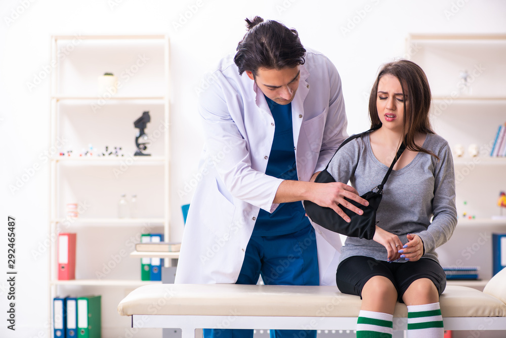 Young male doctor and female beautiful patient Young male doctor and female beautiful patient