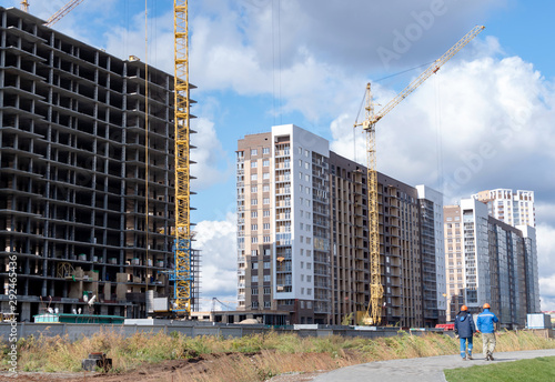 Fotografie High rise building with cranes under construction