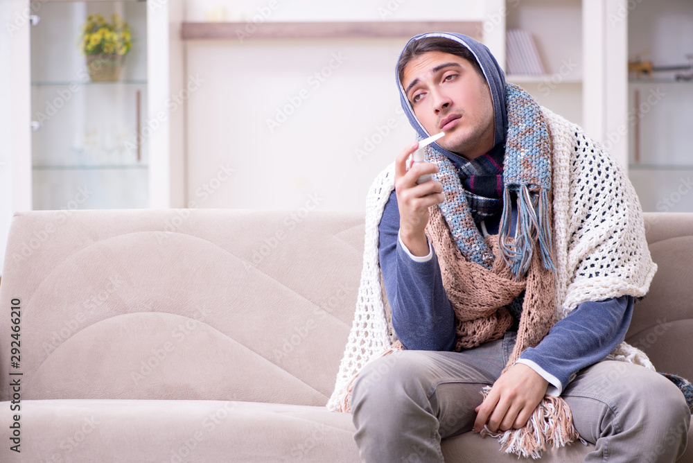 Young man suffering at home