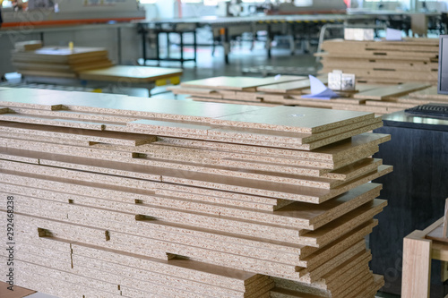 MDF boards stacked up inside the factory workshop photo