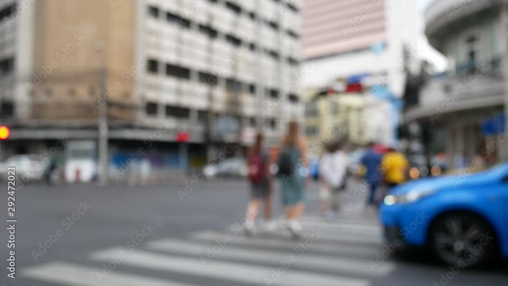 Blurred people and tourist cross the road with traffic in Bangkok Thailand. Blurred people and tourist cross the road with traffic in Bangkok Thailand.