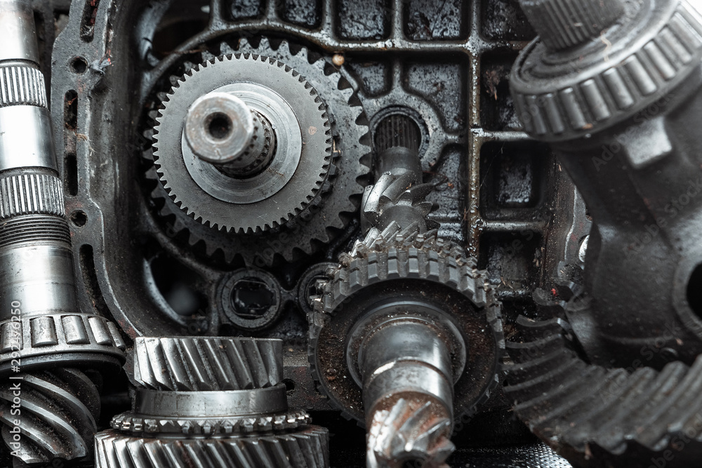 Dismantled car gearbox with gears, close-up. Repair box predach, repair of used cars. Metal background. Dismantled car gearbox with gears, close-up. Repair box predach, repair of used cars. Metal background.