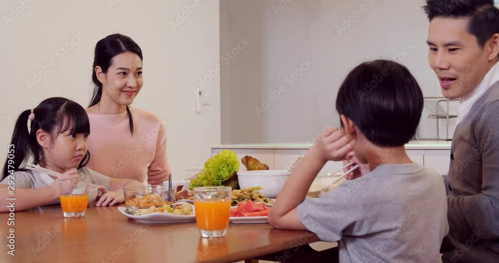 Happy family having dinner together at home. Asian family eating Asian ...