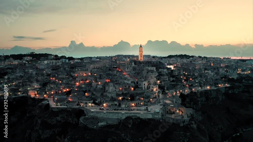 Beautiful evening shot of the historic old town of Matera, Basilicata, Italy - one of the fastest growing cities in the south of Italy and a european capital of culture. Aerial view.  photo
