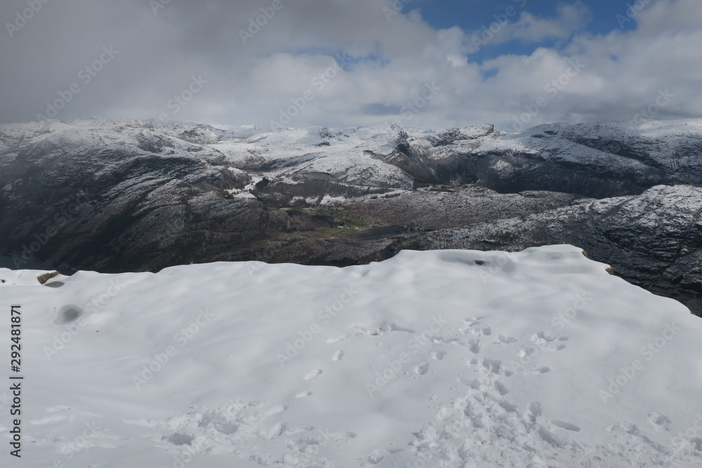 Preikestulen (Pulpit Rock) with snow in Norway in the spring Preikestulen (Pulpit Rock) with snow in Norway in the spring