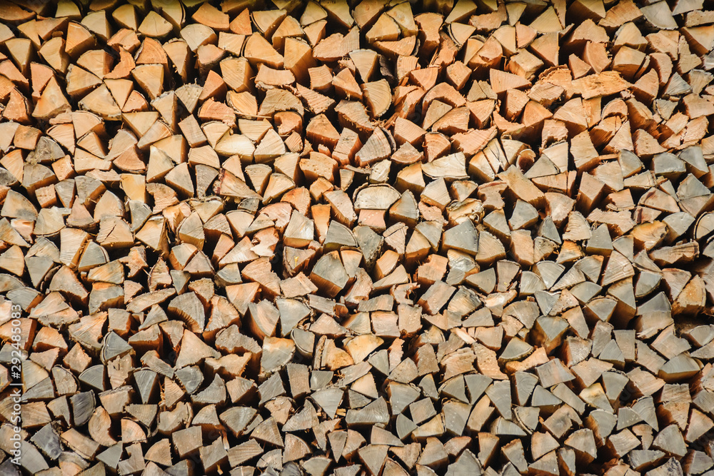 An array of firewood for burning in a stove is piled. An array of firewood for burning in a stove is piled.