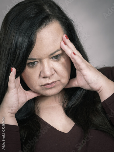 Worried woman having painfull headache © Voyagerix