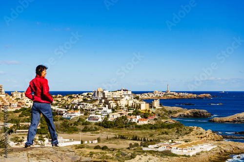 Tourist woman on sea coast in Spain