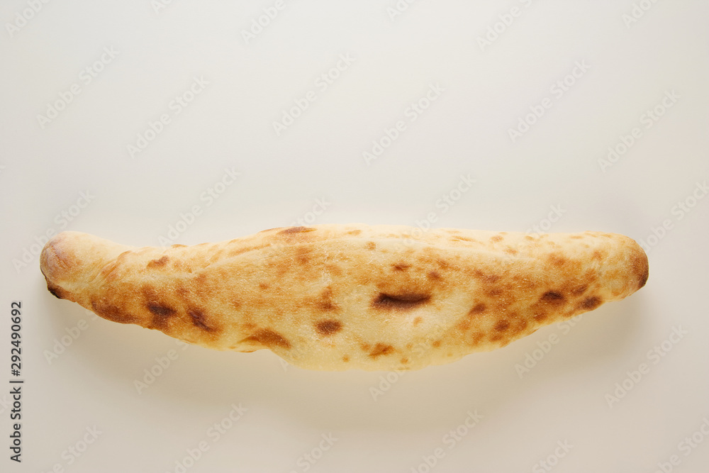 Georgian traditional bread shoti on white background with copy space Georgian traditional bread shoti on white background with copy space