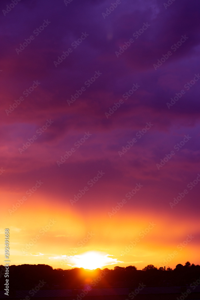 Fototapeta premium Beautiful pink and orange sunset over the city; nature background