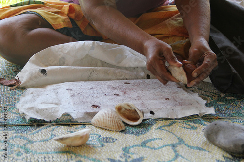 Siapo is uses for clothing, burial shrouds, bed covers, ceremonial garments and much more. A woman demostrate the making of siapo from extracting the bark, till drying and painting on it.