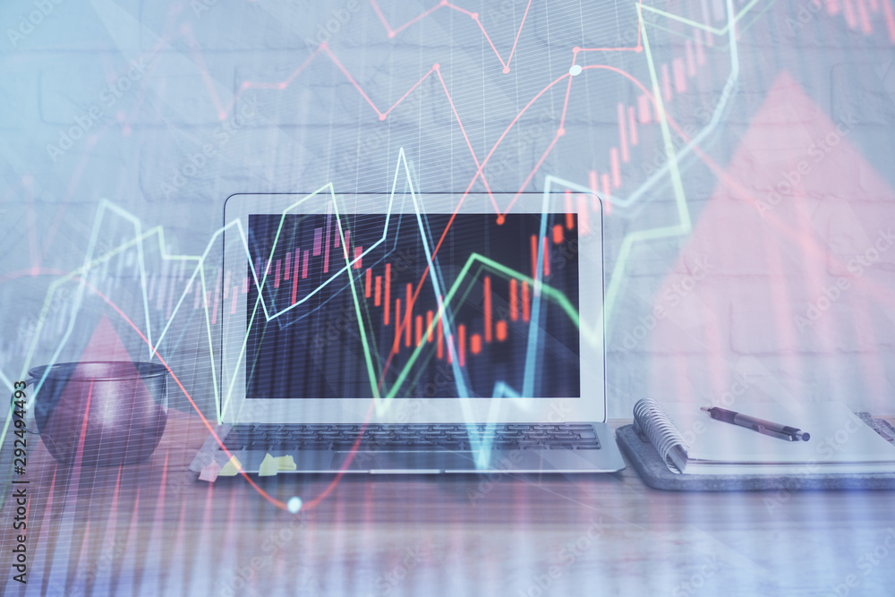 Stock market graph and table with computer background. Double exposure. Concept of financial analysis. Stock market graph and table with computer background. Double exposure. Concept of financial analysis.