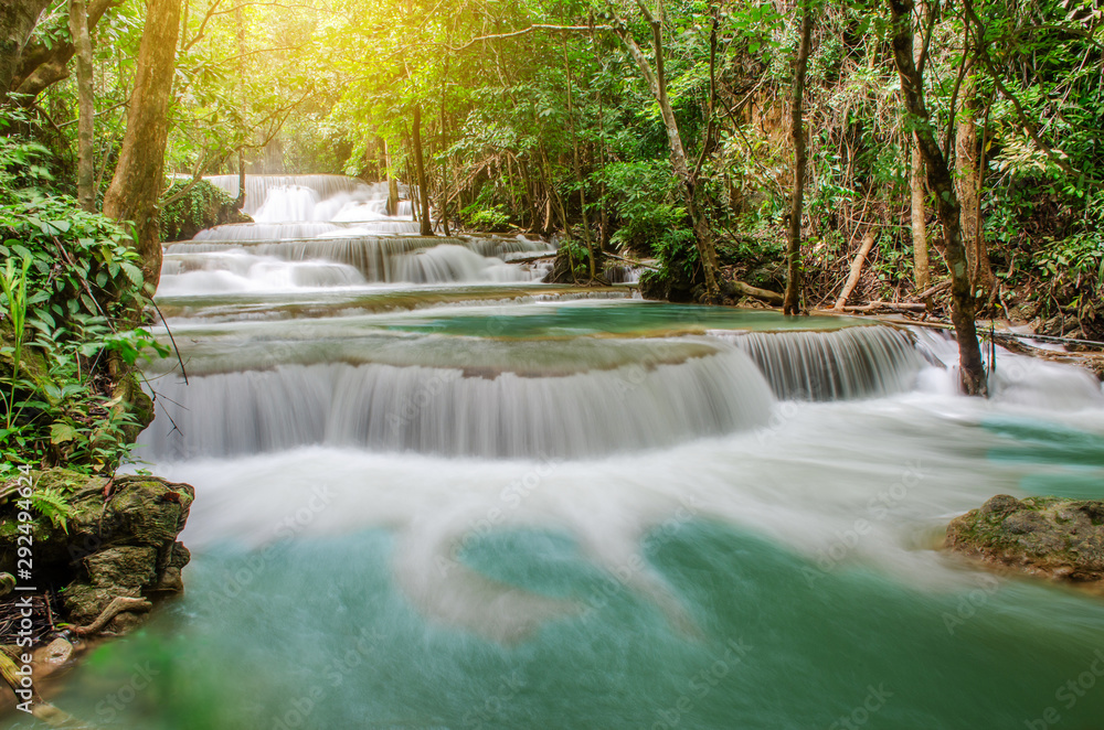 Travel to the beautiful waterfall in tropical rain forest, soft water of the stream in the natural park at Huai Mae Khamin Waterfall in Kanchanaburi, Thailand. Travel to the beautiful waterfall in tropical rain forest, soft water of the stream in the natural park at Huai Mae Khamin Waterfall in Kanchanaburi, Thailand.