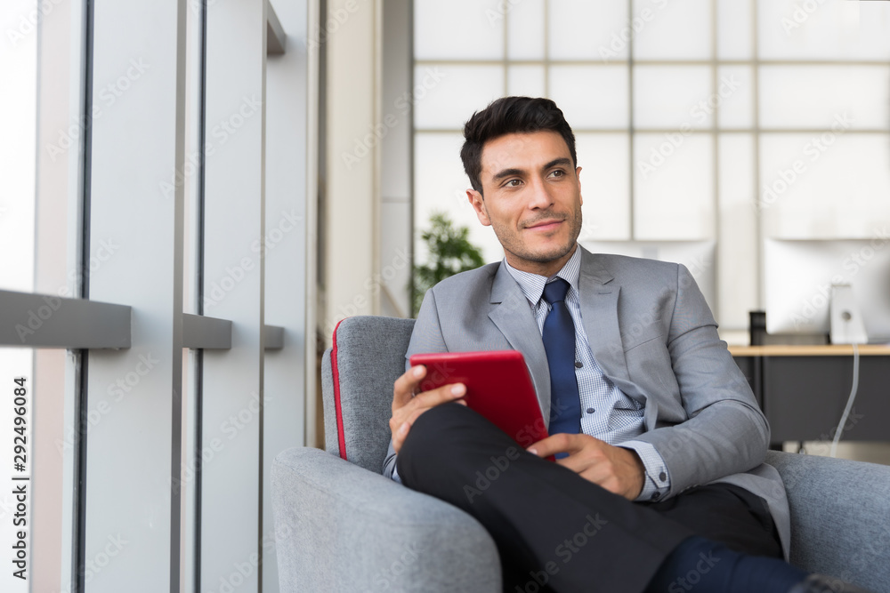 Businessman uses tablet computer in break time.. Businessman uses tablet computer in break time..