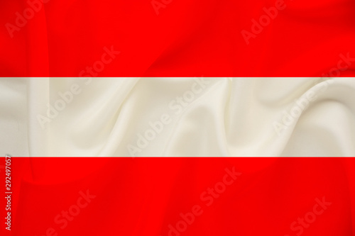 national flag of Austria on delicate silk with wind folds, travel concept, immigration, politics